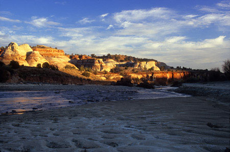 Sun setting on Navajo Sandstone in Paria River